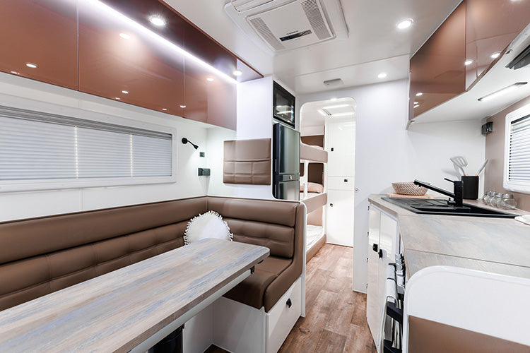 ProRV Falcon Angle Kitchen Caravan Interior Living Area Angled to Include Fridge, Microwave and Bunks.