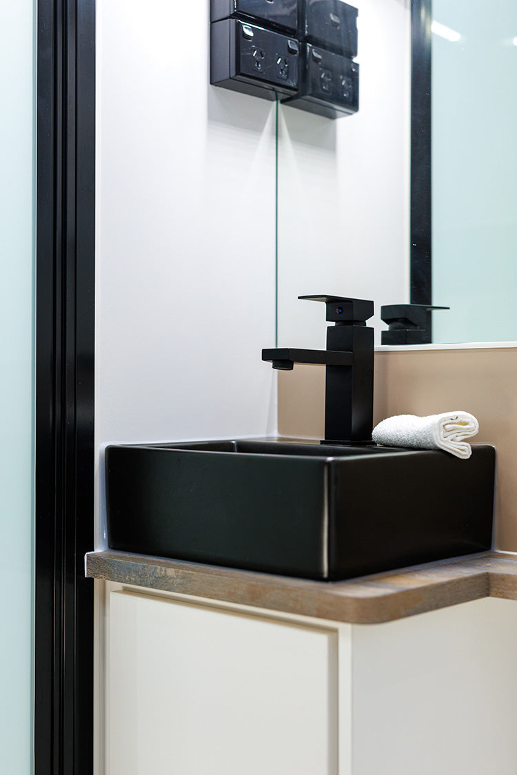 ProRV Falcon Angle Kitchen Cravan Interior Toilet Including Tap, Sink, and Mirrors Zoomed In.