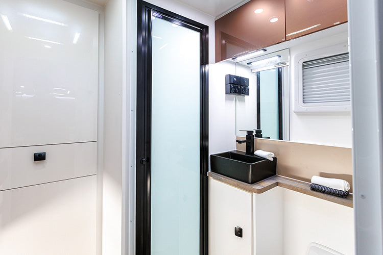 ProRV Falcon Angle Kitchen Cravan Interior Toilet Including Tap, Sink, and Drawers.