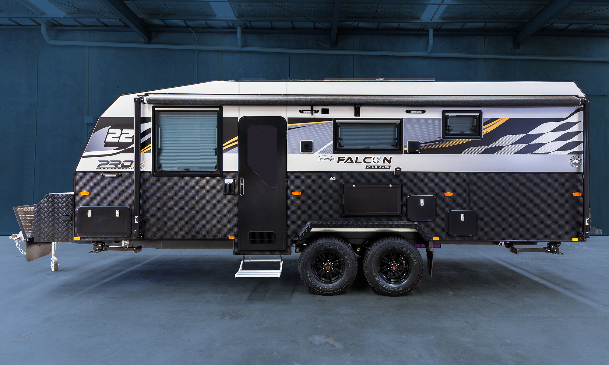 PRO RV Caravans Falcon caravan parked in a warehouse.