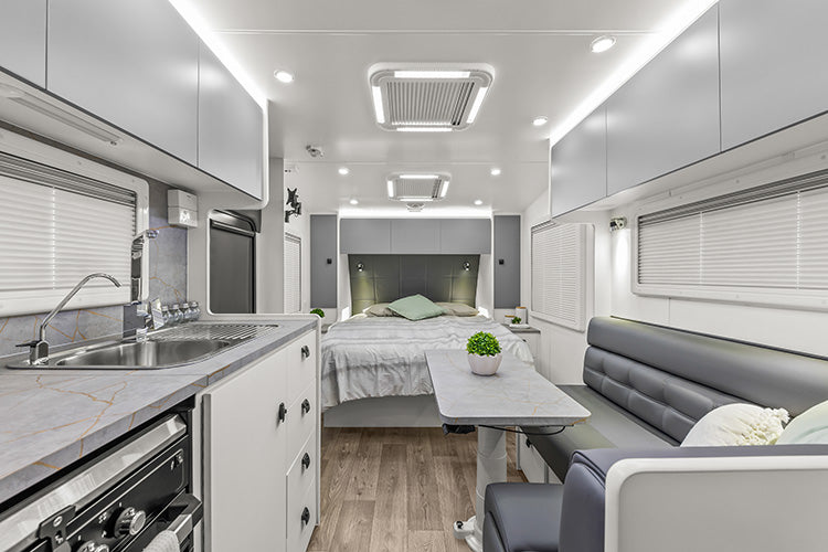 ProRV Family Jaguar Caravan Interior Living Area Full View Facing Bed.