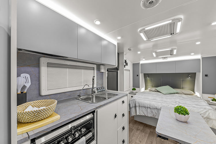 ProRV Family Jaguar Caravan Interior Living Area Full View Facing Bed Angled towards Kitchen.