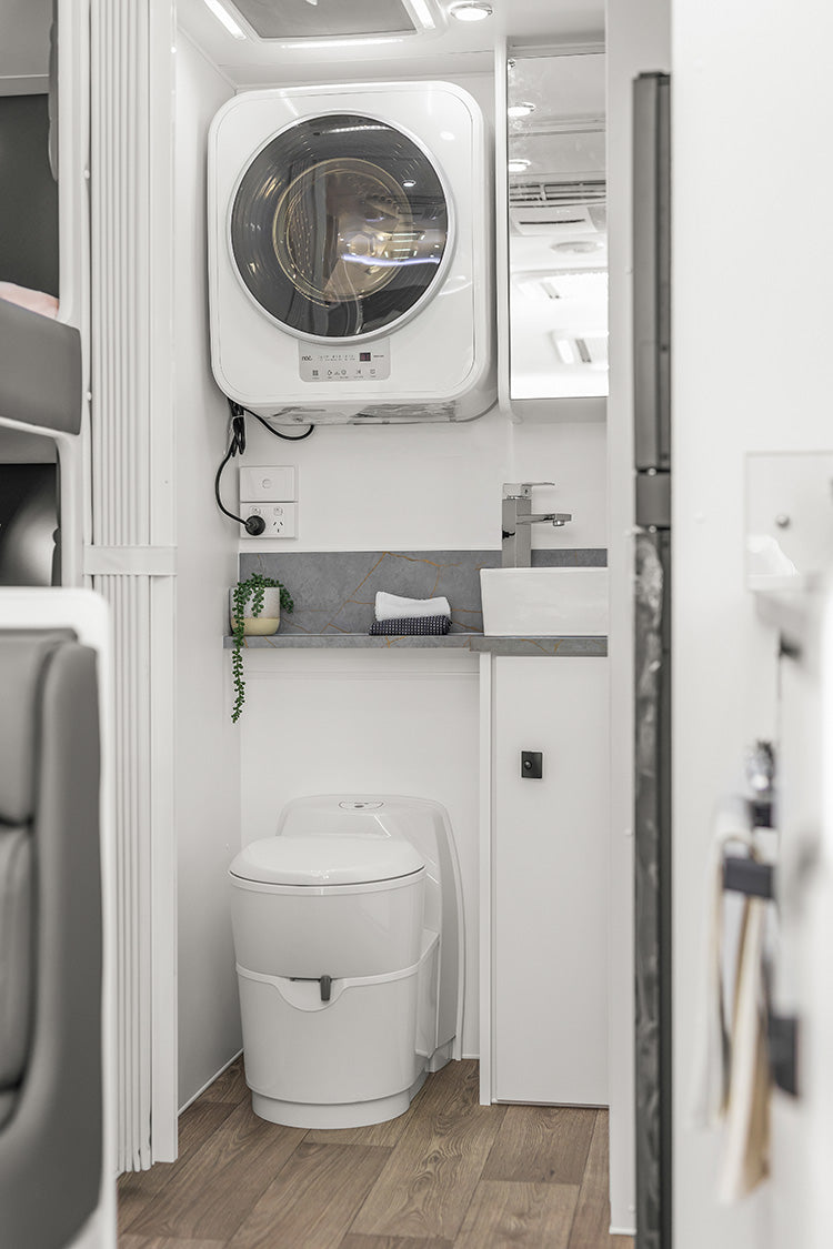 ProRV Family Jaguar Cravan Interior Toilet Including Tap, Sink, Cupboards, Toilet and Washing Machine.