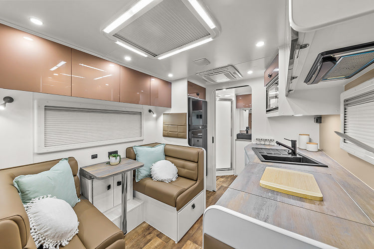 ProRV Kookaburra Aluminium Frame Caravan Interior Living Area Full View Facing Toilet Angled Towards Table and Chairs.