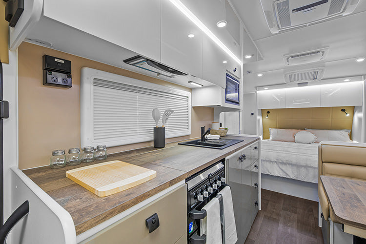 ProRV Panda Aluminium Frame Caravan Interior Living Area Full View Facing Bed Angled Towards Kitchen.