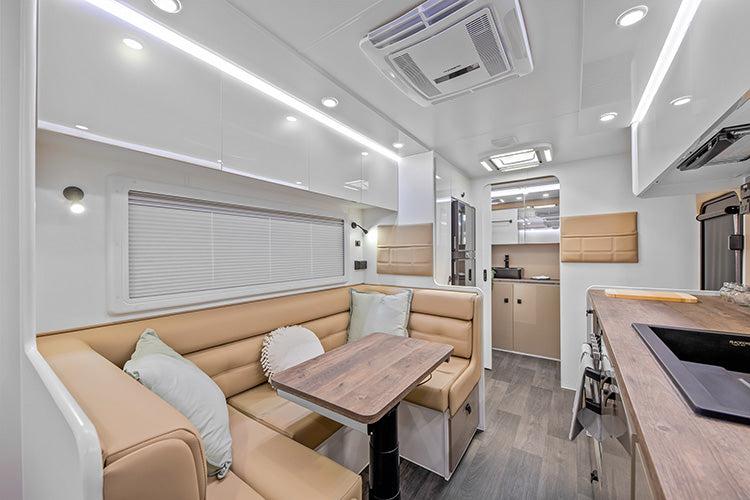 ProRV Panda Aluminium Frame Caravan Interior Living Area Full View Facing Toilet Angled Towards Table and Chairs.