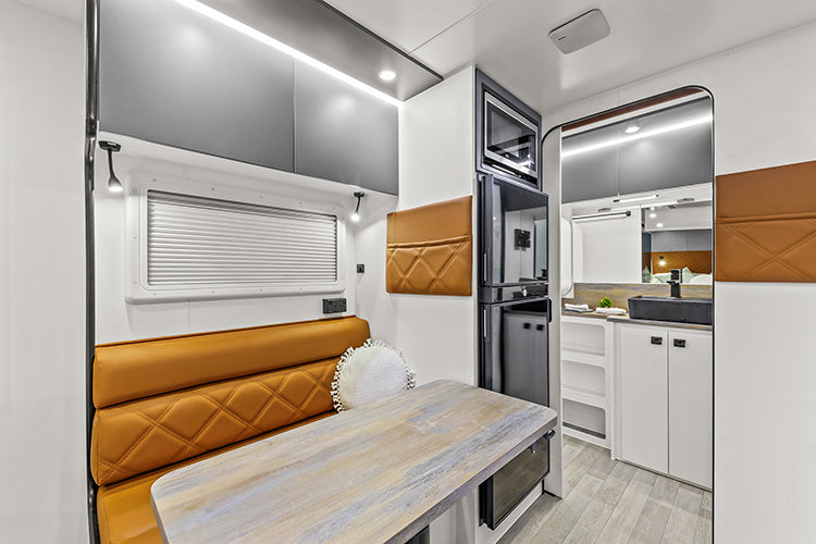 ProRV Puma Aluminium Frame Caravan Interior Table and Chairs Angled to Include Fridge, Microwave and Toilet.