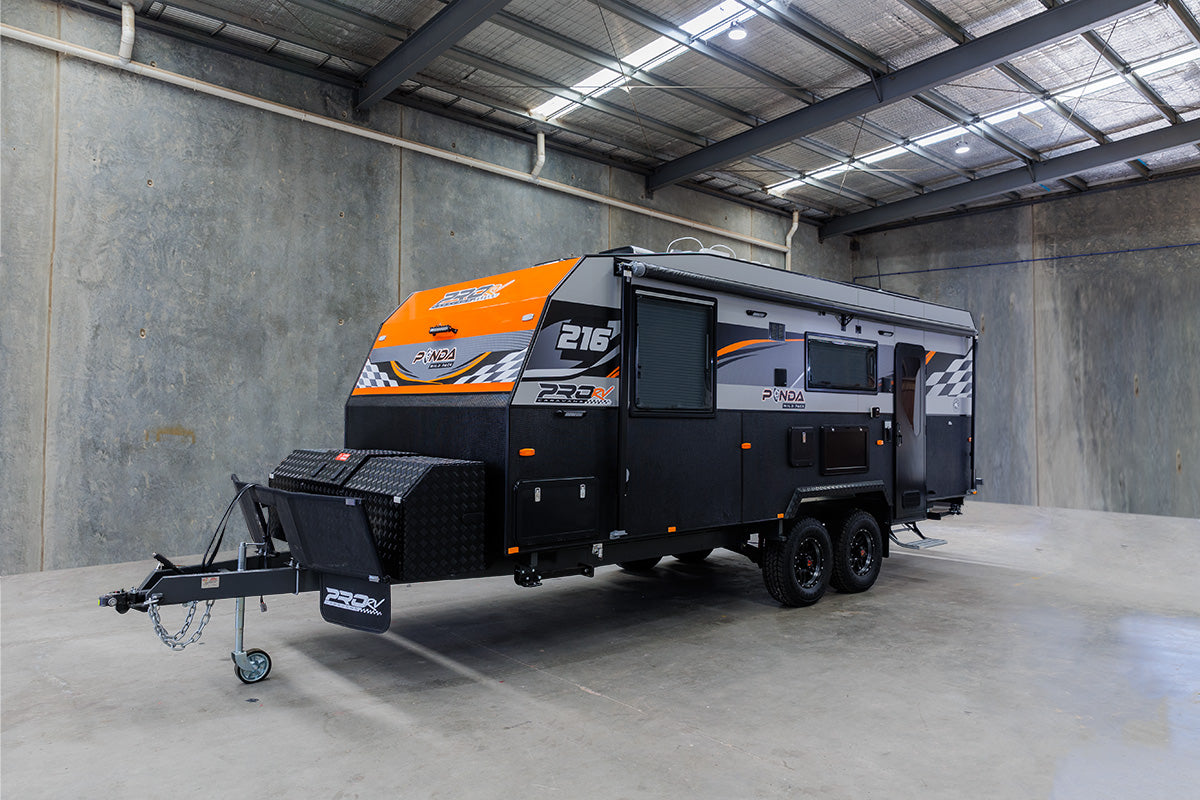 ProRV Kookaburra aluminium frame caravan parked in brightly light up warehouse.