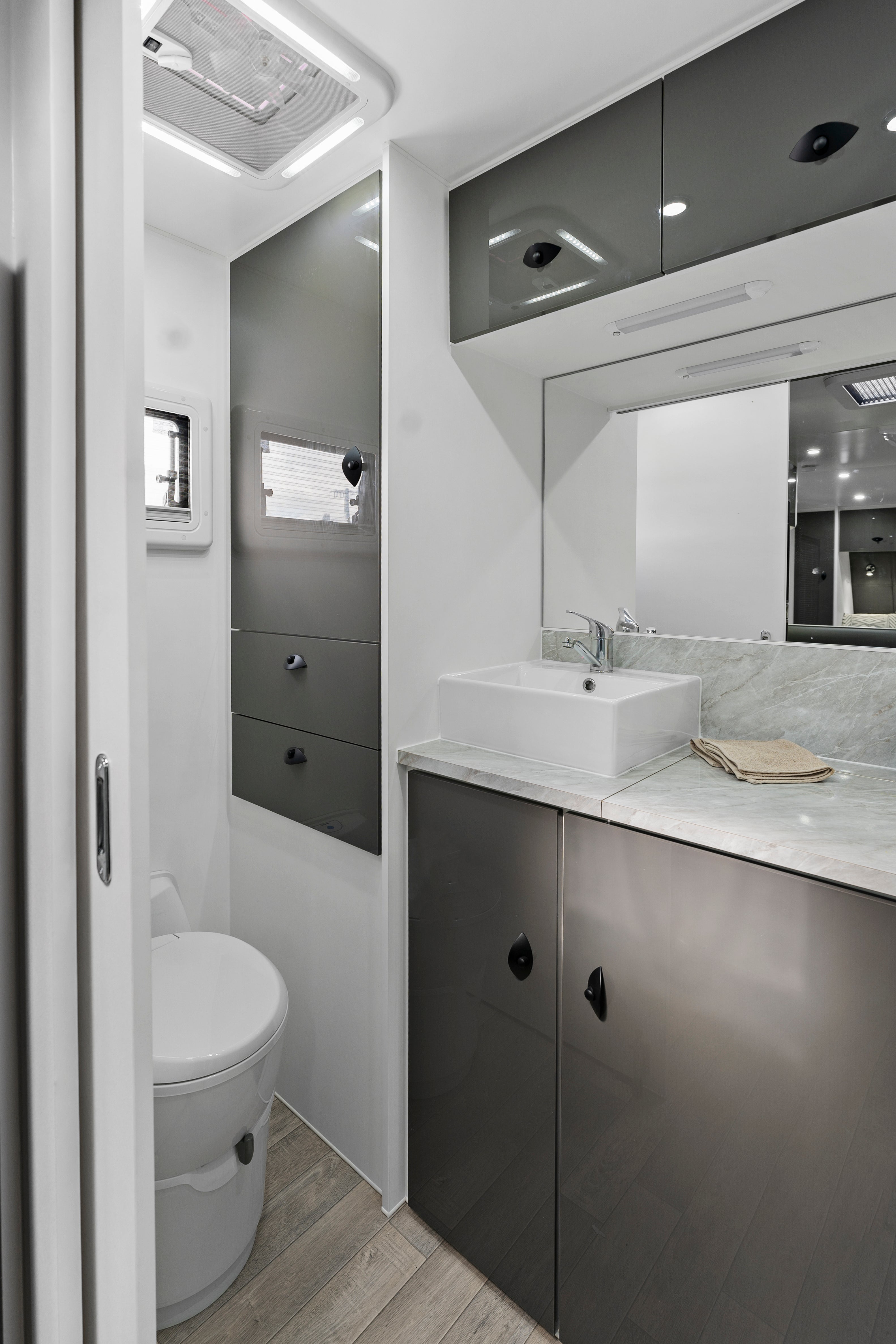 ProRV Jaguar Cravan Interior Toilet Including Tap, Sink, Cupboards, Drawers and Toilet.