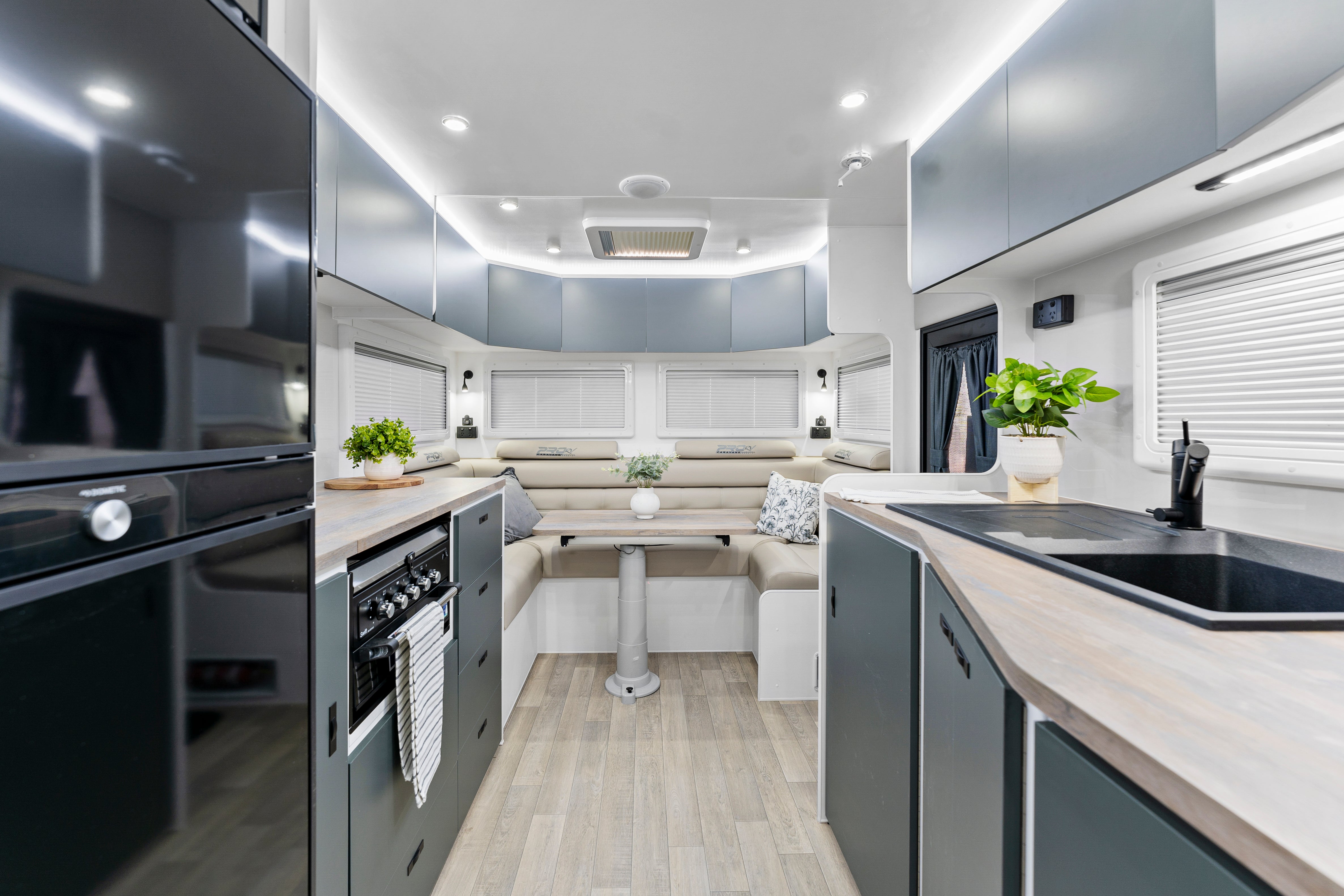 ProRV Panther Aluminium Frame Caravan Interior Living Area Full View Facing Table and Chairs.