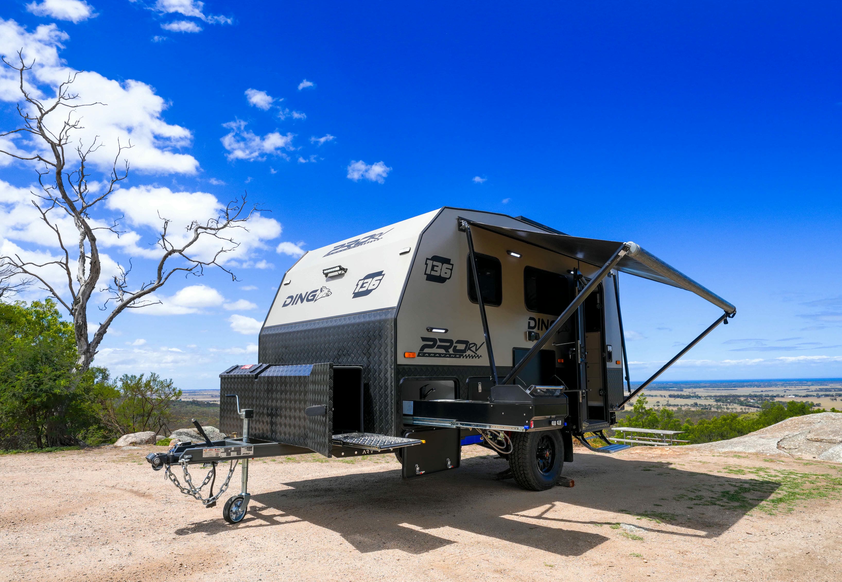 Pro RV Caravans Dingo Caravan in scenic background with awning laid out.