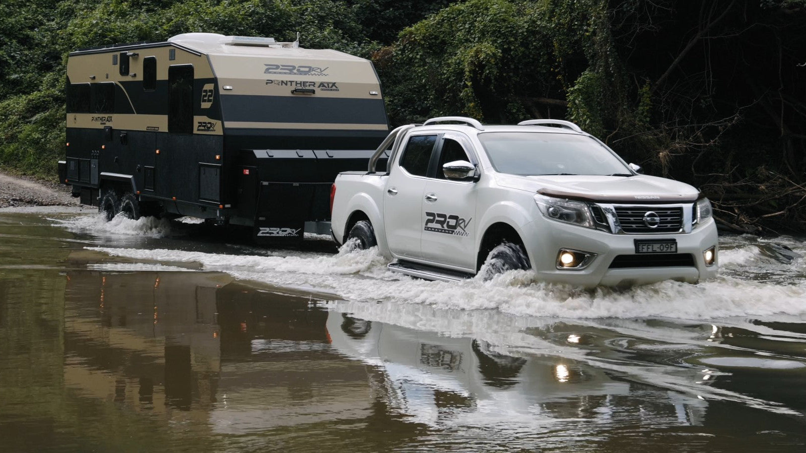 Pro RV Panther off road caravan crossing river.